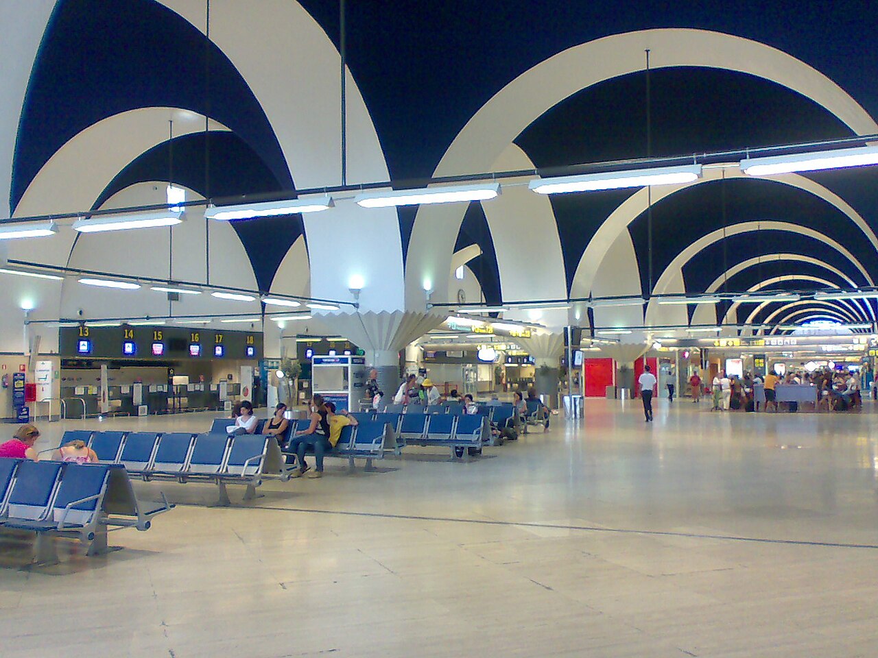 Seville Airport departures hall beneath a vaulted ceiling, in an archive photograph from 2008.